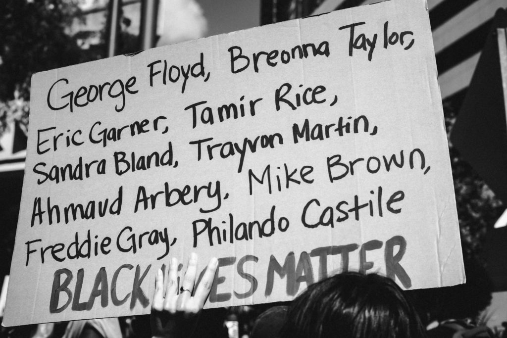 Sign containing the names of victims of police violence. 