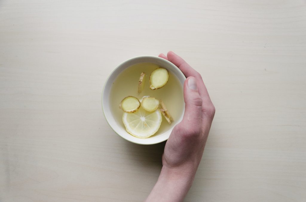 Have holding a cup of lemon ginger tea